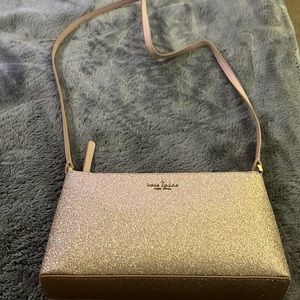 Used Kate spade shiny pink crossbody purse with mini wallet included